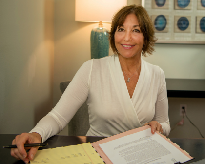 Karen Reynolds sitting at a desk